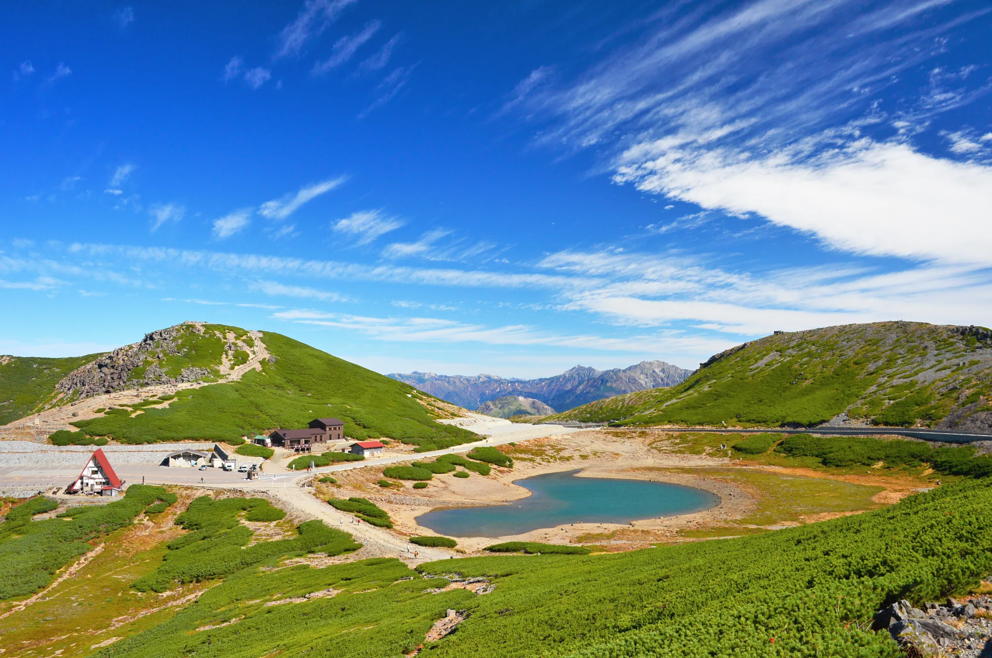 Tsurugaike Pond at Tatamidaira on Mount Norikura with the Hotaka range in the distance