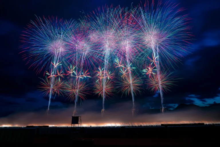 Wide bursts of the Omagari National Fireworks Competition over the Omono River in Daisen Akita