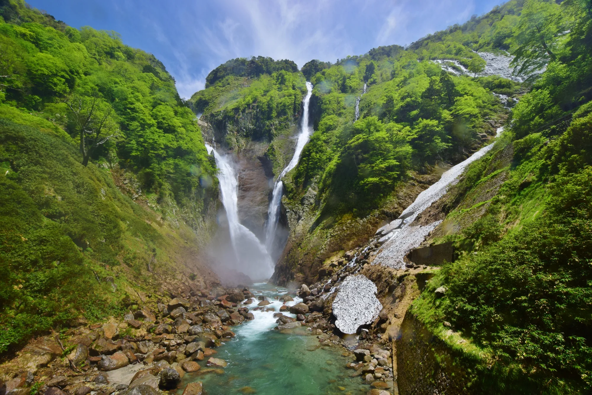 Shomyo Falls dropping into its green summer gorge, Tateyama, Toyama