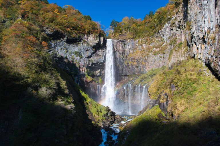 Kegon Falls in Nikko, Tochigi: the 97-metre main drop plunging over a sheer cliff from Lake Chuzenji, one of Japan's three most famous waterfalls, with mist rising from the plunge pool
