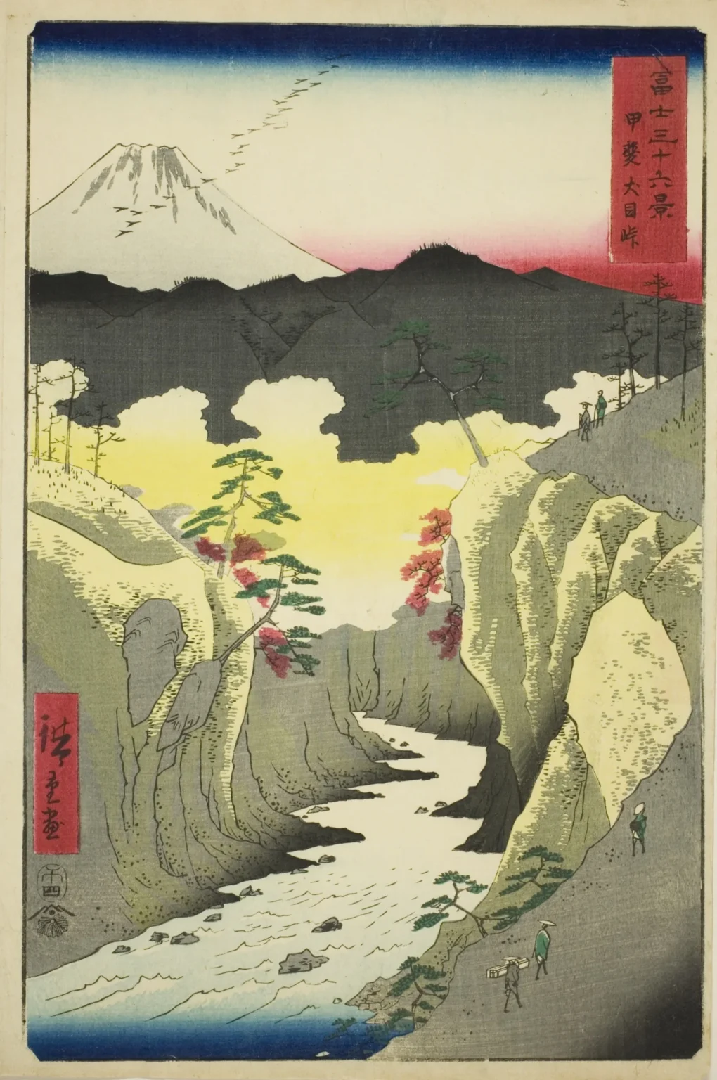 Vertical woodblock print: a white river rushes down a deep gorge between pale yellow-grey cliffs, with small travellers on paths cut into the rock and a red-leaved tree on a ledge. Above dark mountain ridges and a band of yellow sky, a small white Mount Fuji sits at upper left, with a line of geese flying beside it.