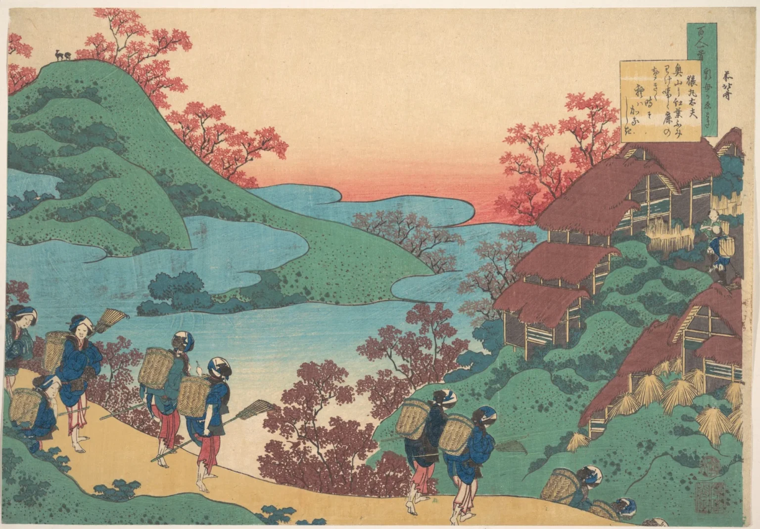 Woodblock print: women with baskets on their backs walk a sandy path past red-leaved shrubs below green hills and thatched farmhouses, under an orange evening sky; two small deer stand on the hilltop at the upper left, and the poem is written in a panel at the top right.