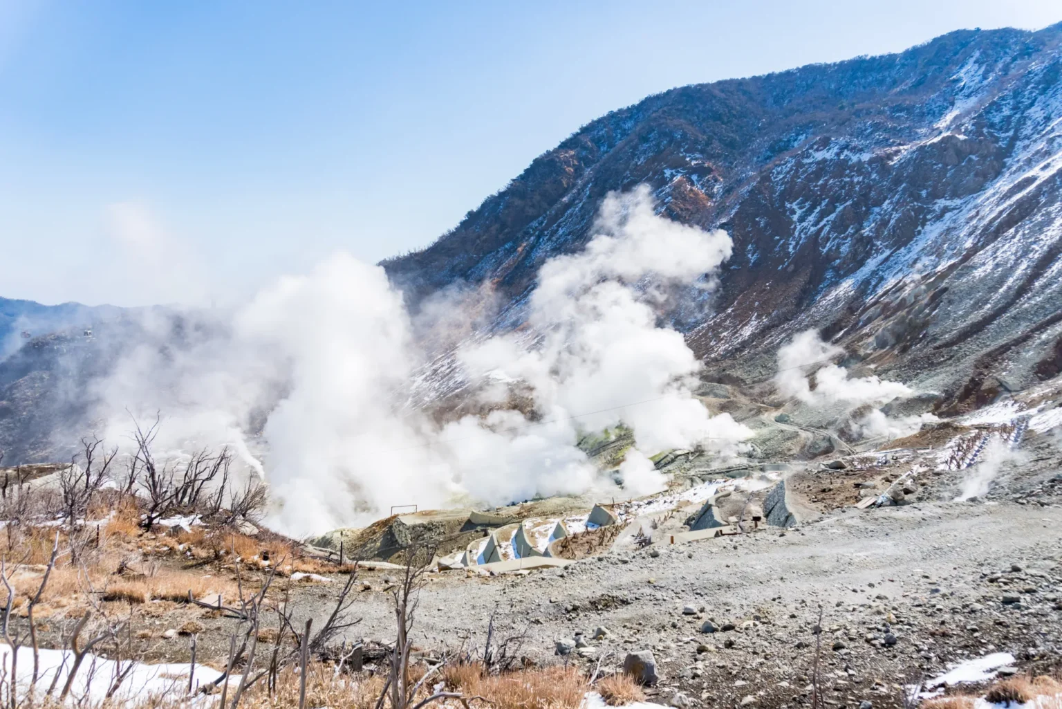 Volcanic steam rising from the slopes of Owakudani in Hakone, with a dusting of snow
