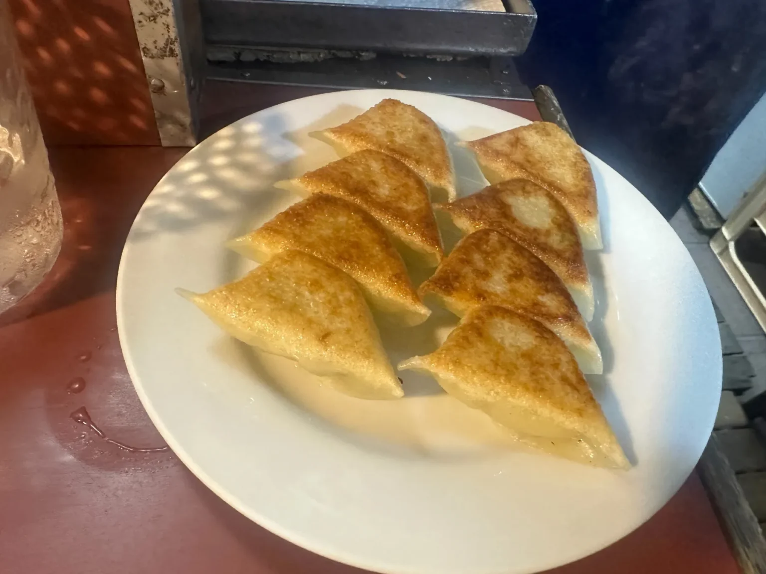 A plate of pan-fried dumplings at a yatai stall in Nakasu